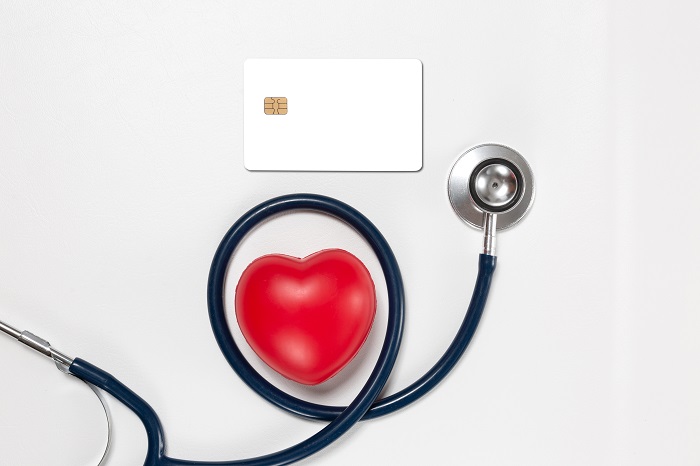 credit card and stethoscope with red heart ,concept pay for heal