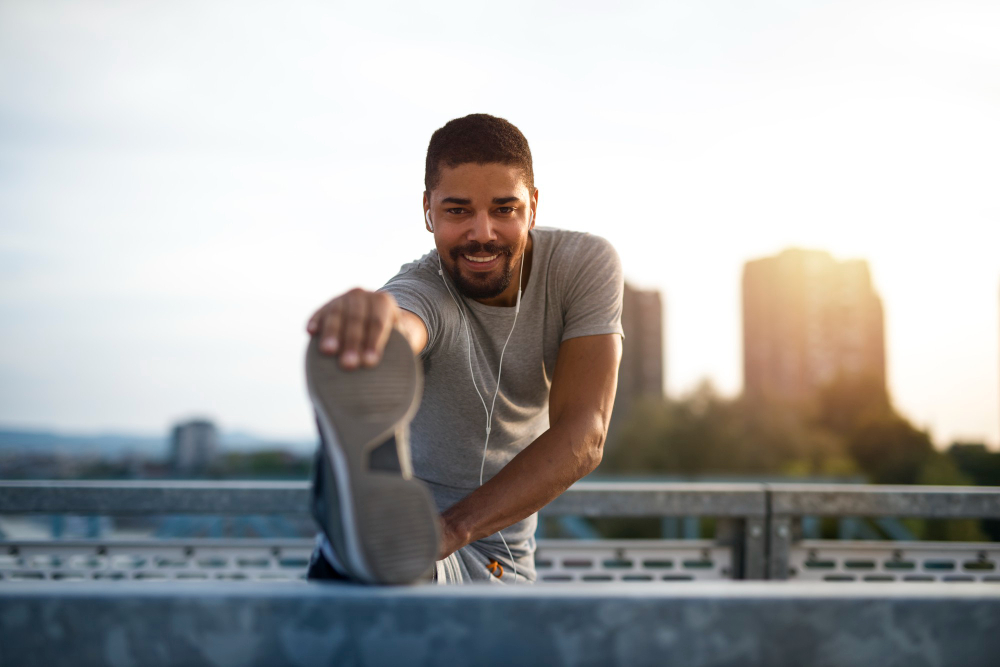 an attractive athlete stretching legs and preparing for running training