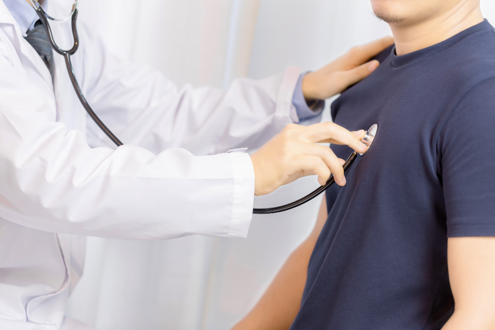 doctor examination young man with stethoscope in hospital