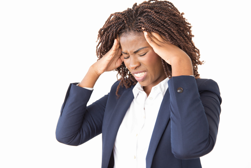 stressed unhappy female employee suffering from headache