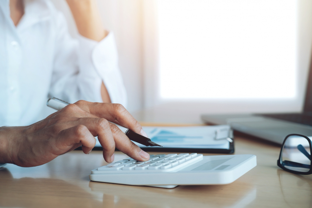 finances saveing economy concept female accountant or banker use calculator