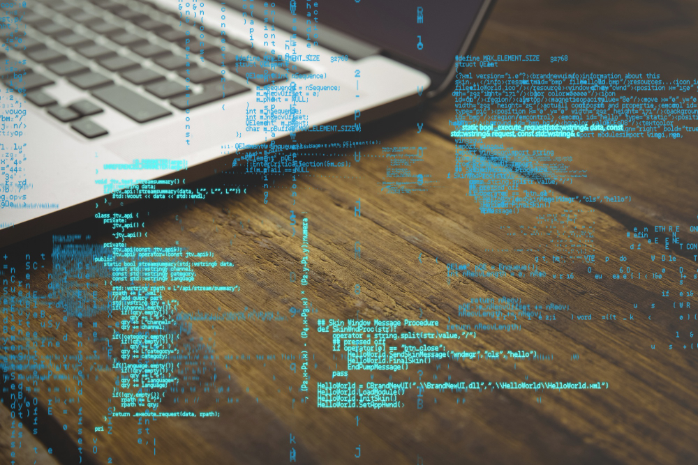 programming code with laptop background