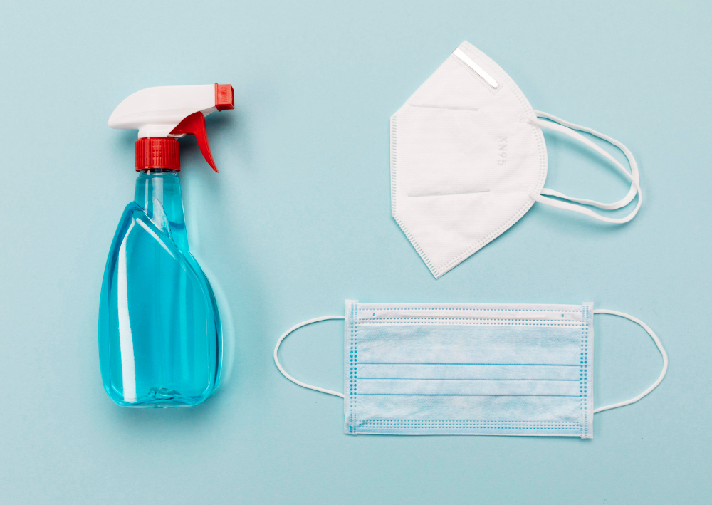 top view medical masks and disinfectant