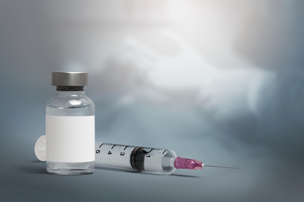 vaccine vial with a needle syringe