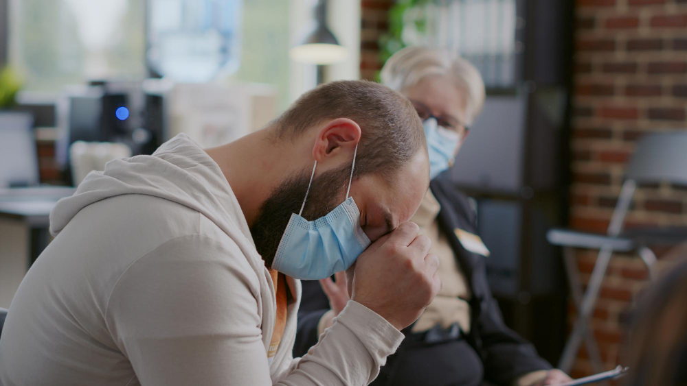 close up of man crying because of mental health issues at aa therapy meeting desperate adult asking for help and advice to cure addiction and depression at support group session