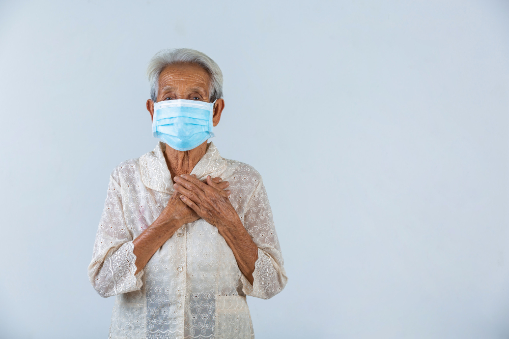 grandmother is puting her hands in the lock and hoped for the best cencept mask campaign