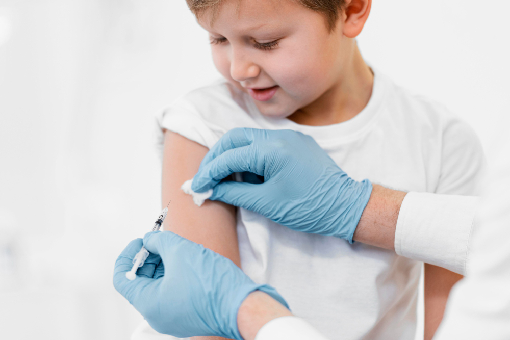 close up little boy getting vaccine