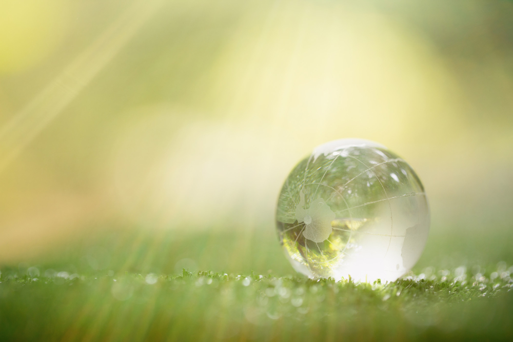 close up of green planet in your hands save earth