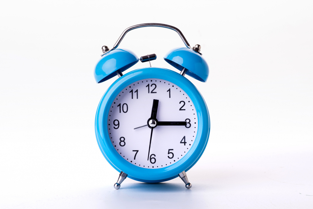 blue alarm clock on white background