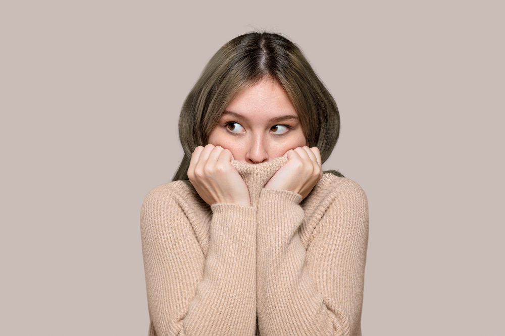 woman in a beige sweater
