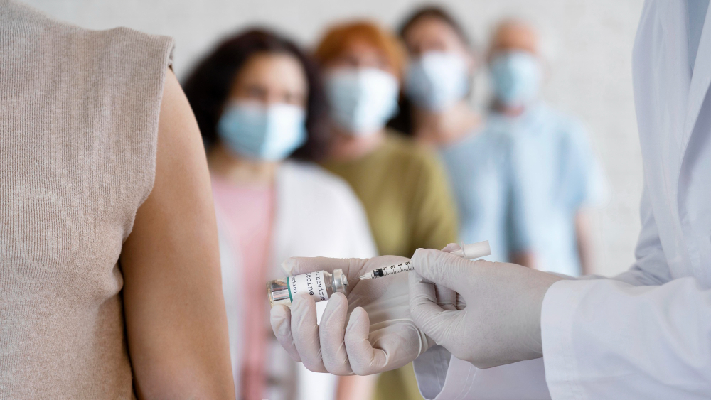 woman getting vaccine shot by doctor