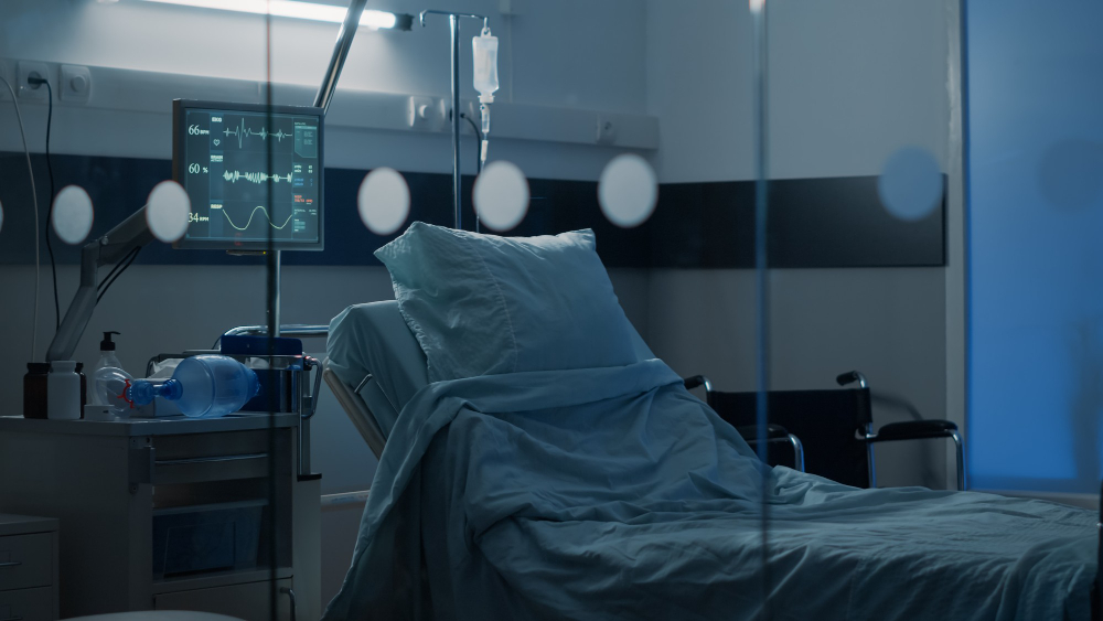 hospital ward with empty bed at clinical facility