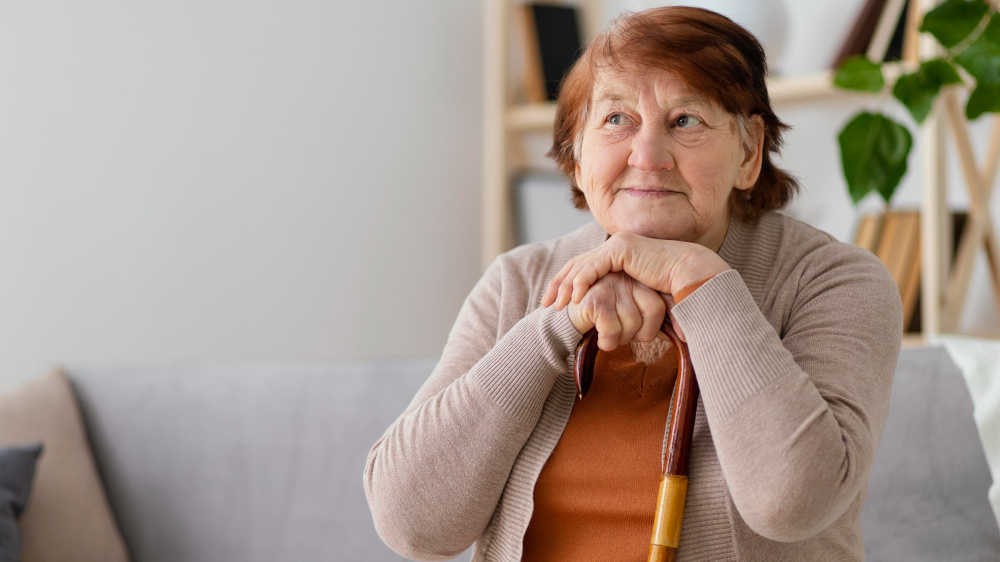 medium shot woman with walking stick