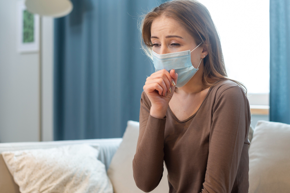 woman with mask staying in quarantine and coughing