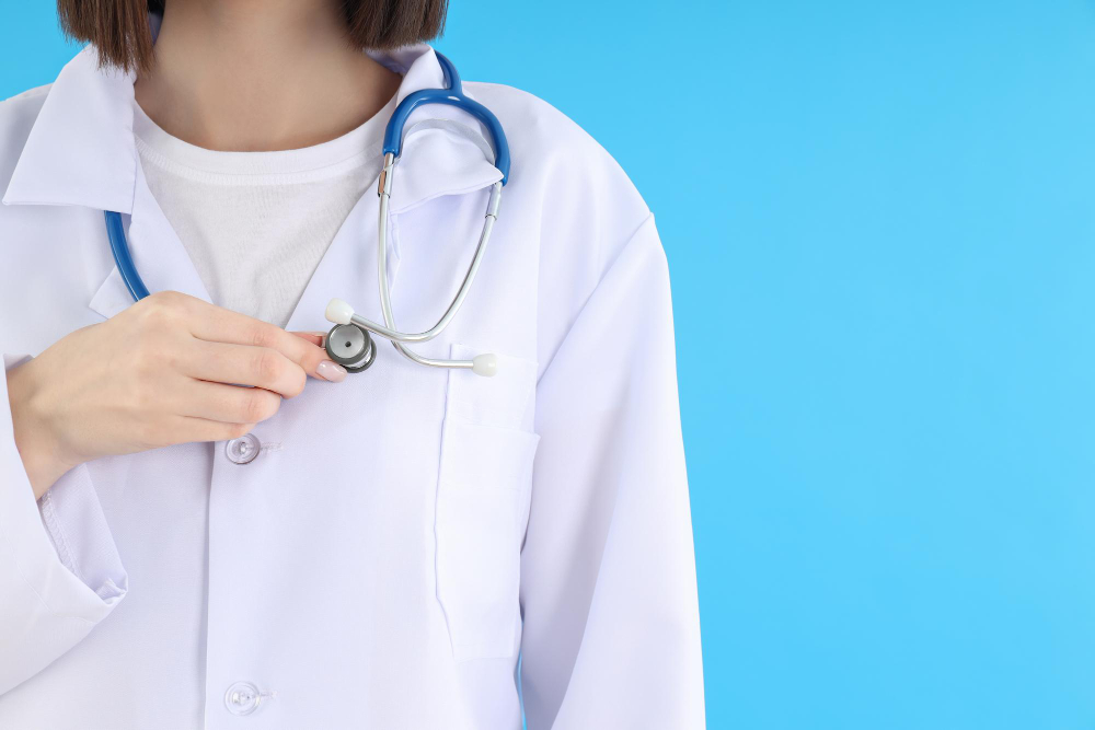 concept of profession young female doctor on blue background