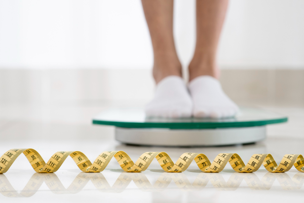 close up legs on weight machine