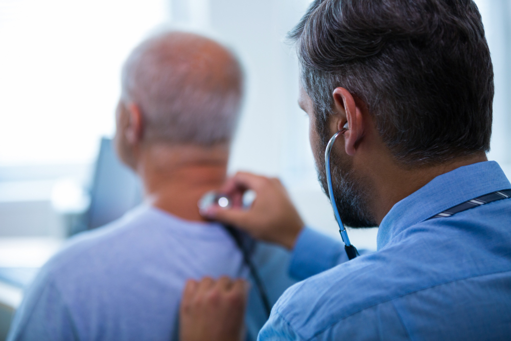 male doctor examining a patient