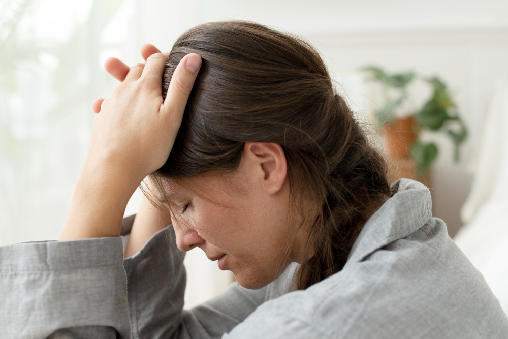 woman suffering from migraine and headache