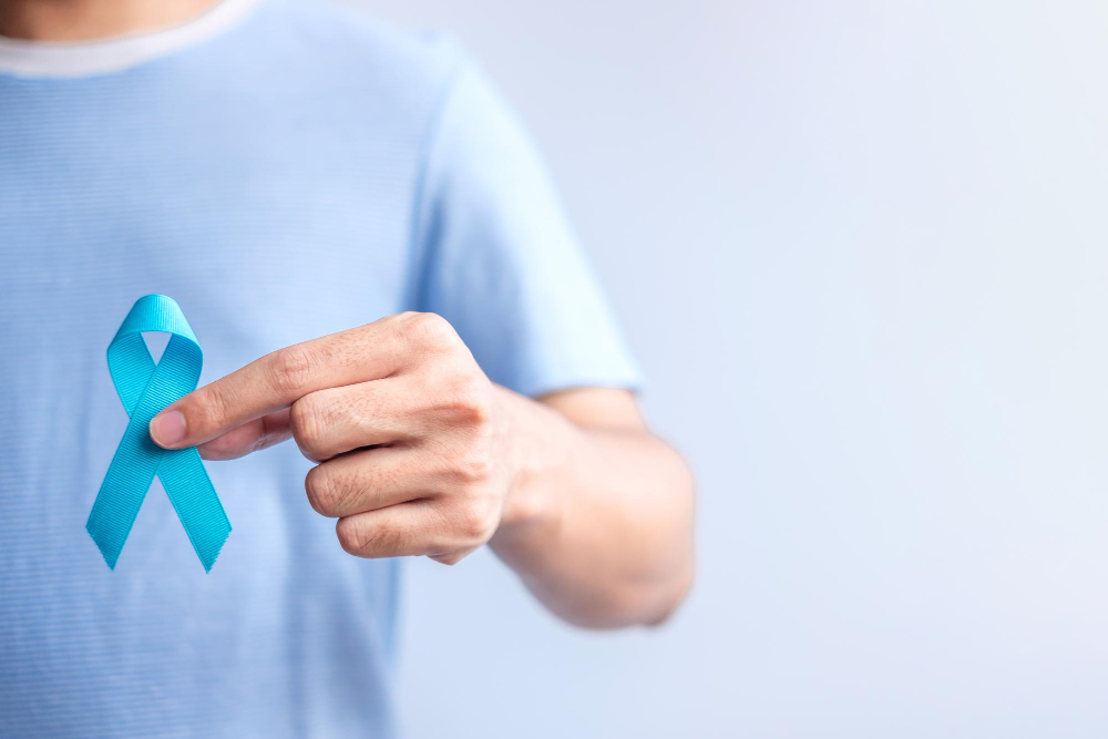 blue november prostate cancer awareness month man in blue shirt with hand holding blue ribbon for support people life and illness healthcare international men father diabetes and world cancer day