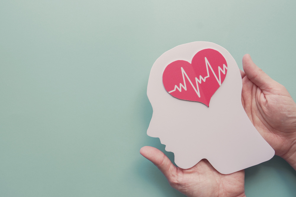 hands holding paper brain heart world heart day