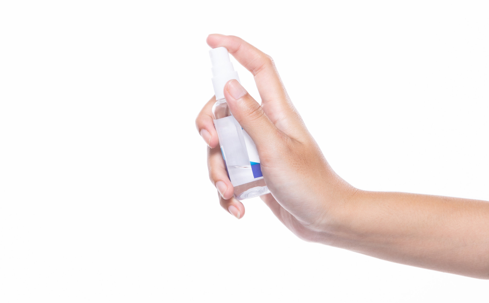 new normal people lifestyle after covid concept woman hand held sanitizer dispenser alcohol spray bottle wash protect coronavirus from other carrier studio isolated white background