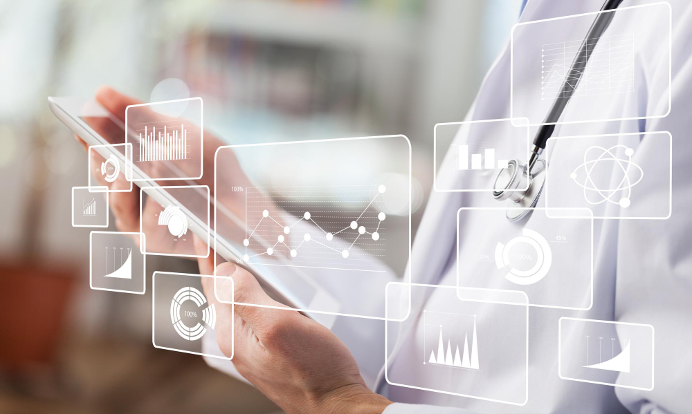 female doctor using digital tablet close up on hands