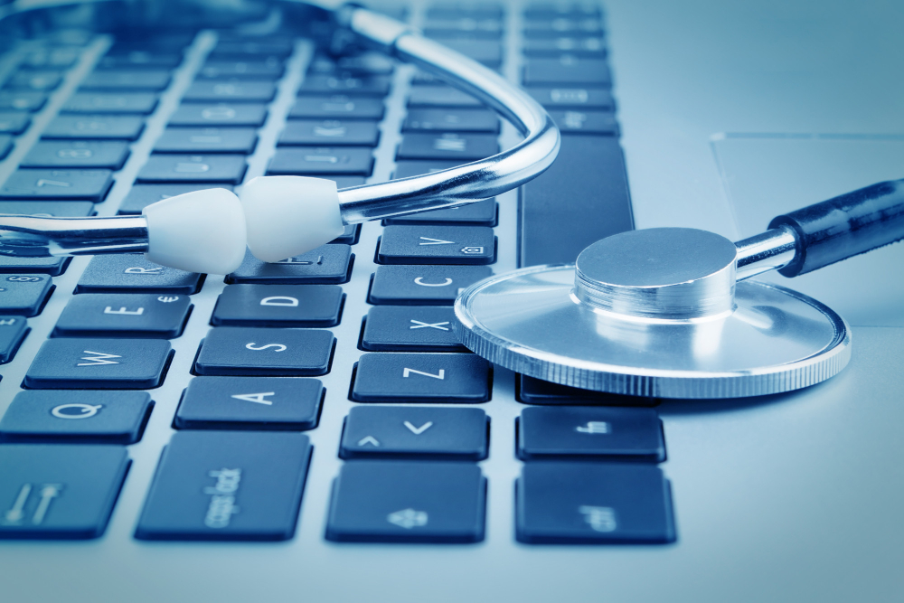 concept photo stethoscope closeup on a laptop in cold tones