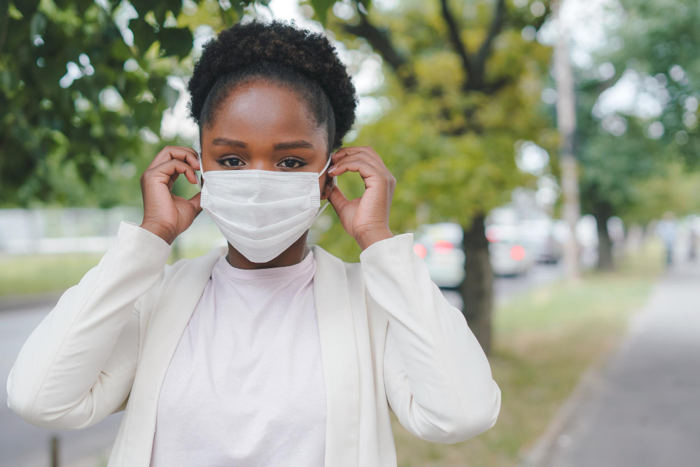 copy space young africanamerican woman putting covid protective face mask before entering office outbreak disease prevention medical health virus epidemic disease health care
