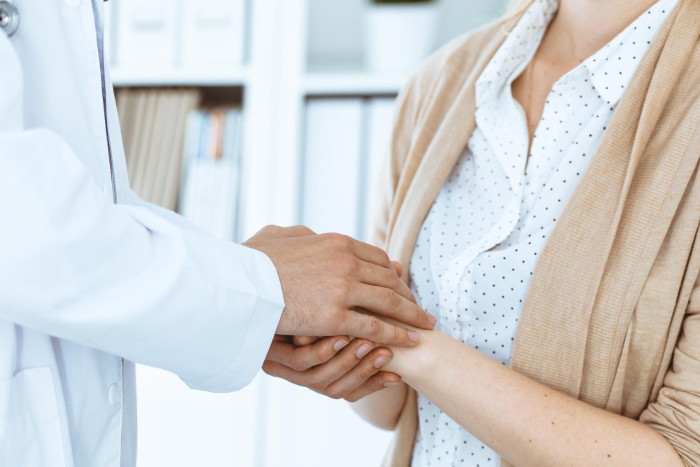 hand doctor reassuring her female patient concepts medical ethics trust medicine