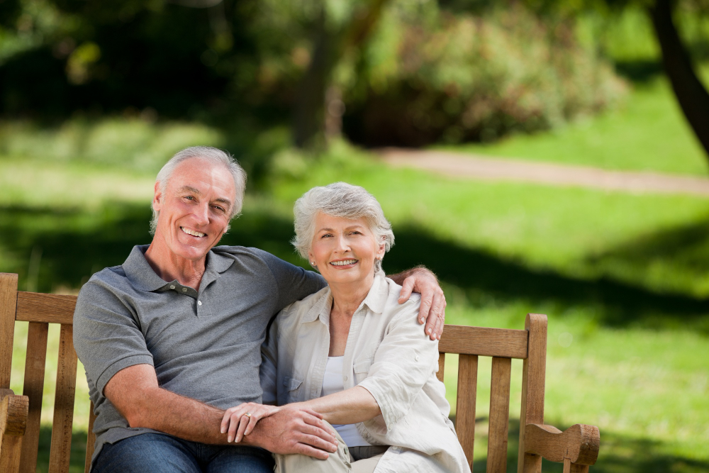 senior couple sitting bench