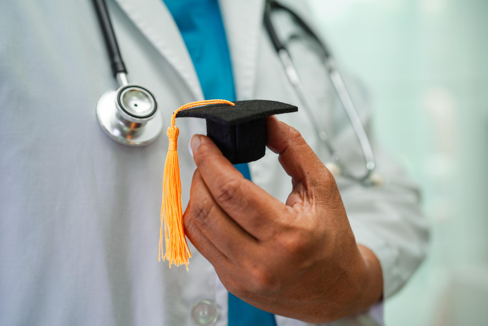 asian woman doctor holding graduation hat hospital medical education concept