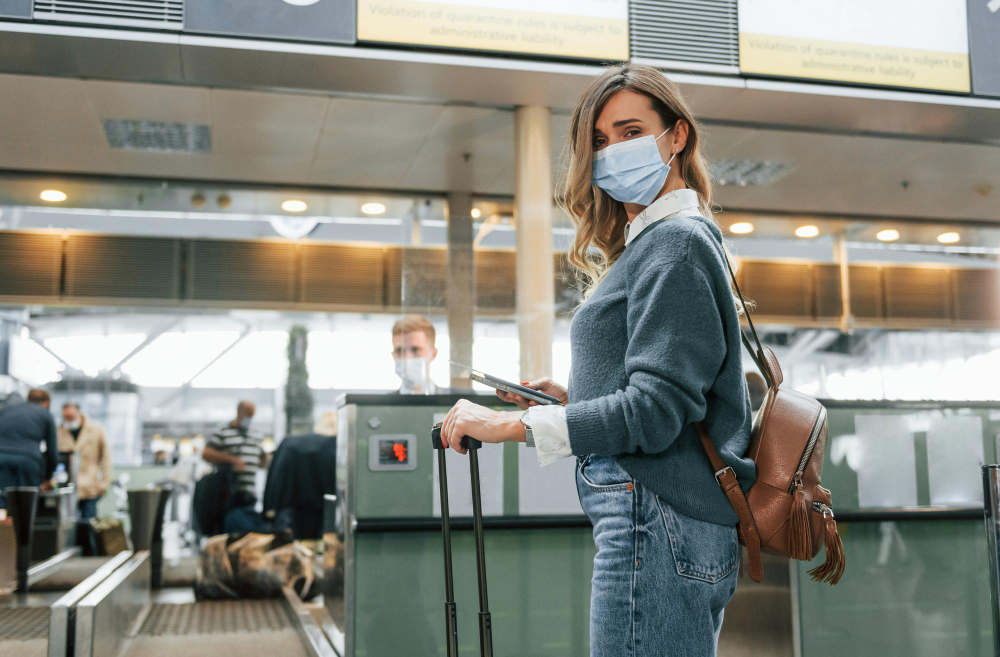 receiving help from worker young female tourist is airport daytime