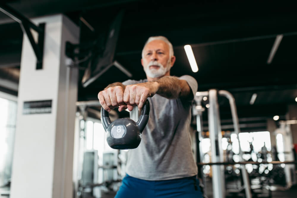 senior man exercising gym ()