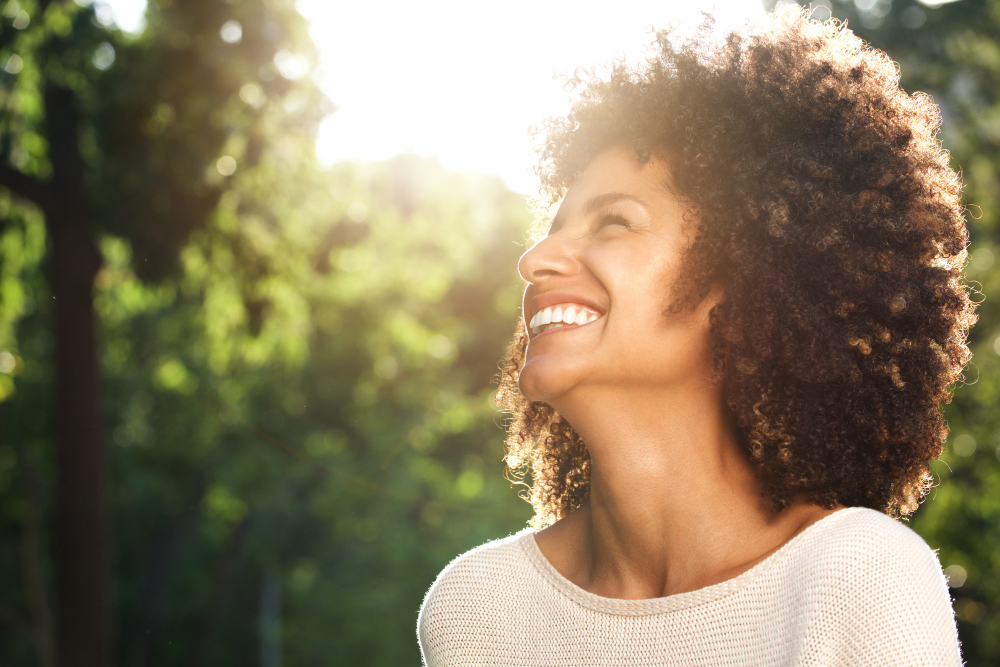 close up portrait beautiful confident woman laughing nature