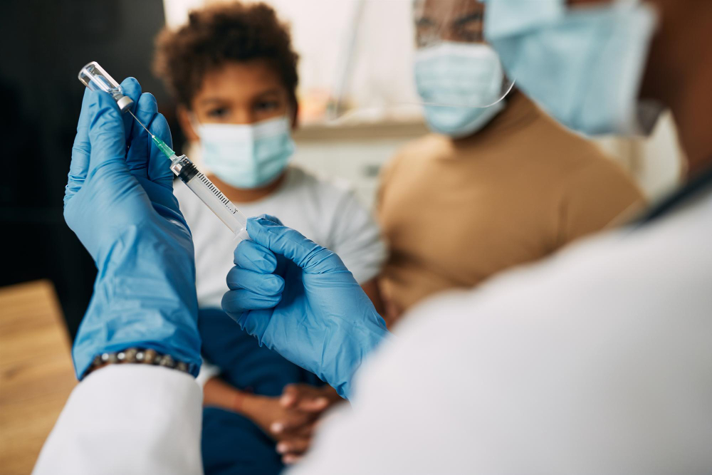 closeup pediatrician preparing vaccine child
