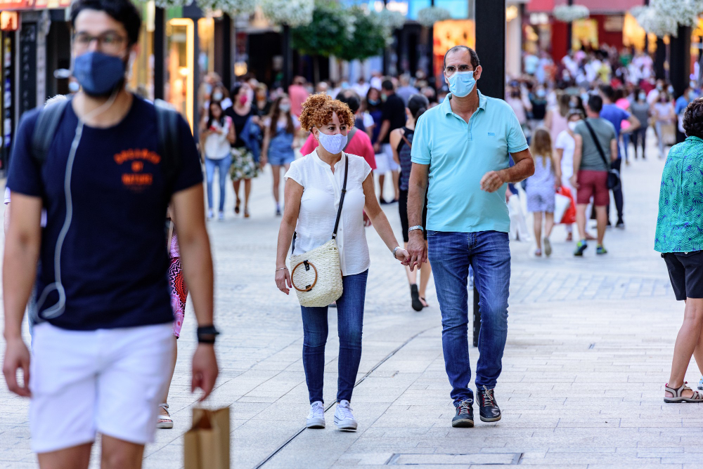 people walk comercial street named meritxell after covid