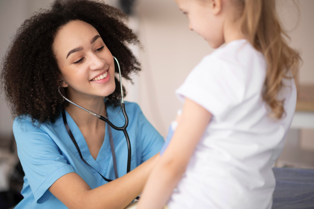 young doctor making sure little girl is fine after vaccination