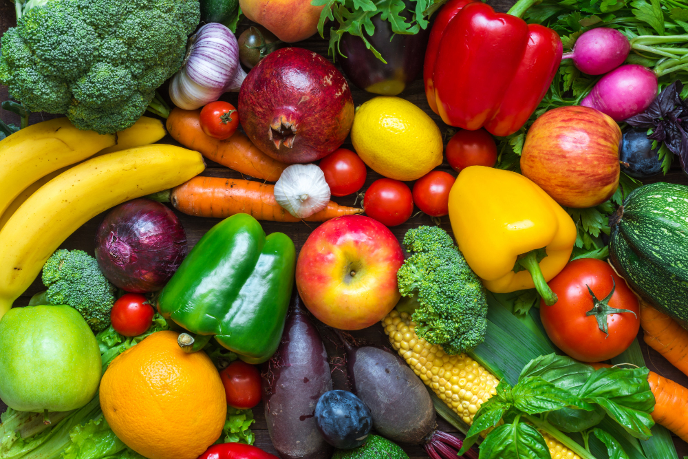 assortment fresh harvested fruits vegetables table