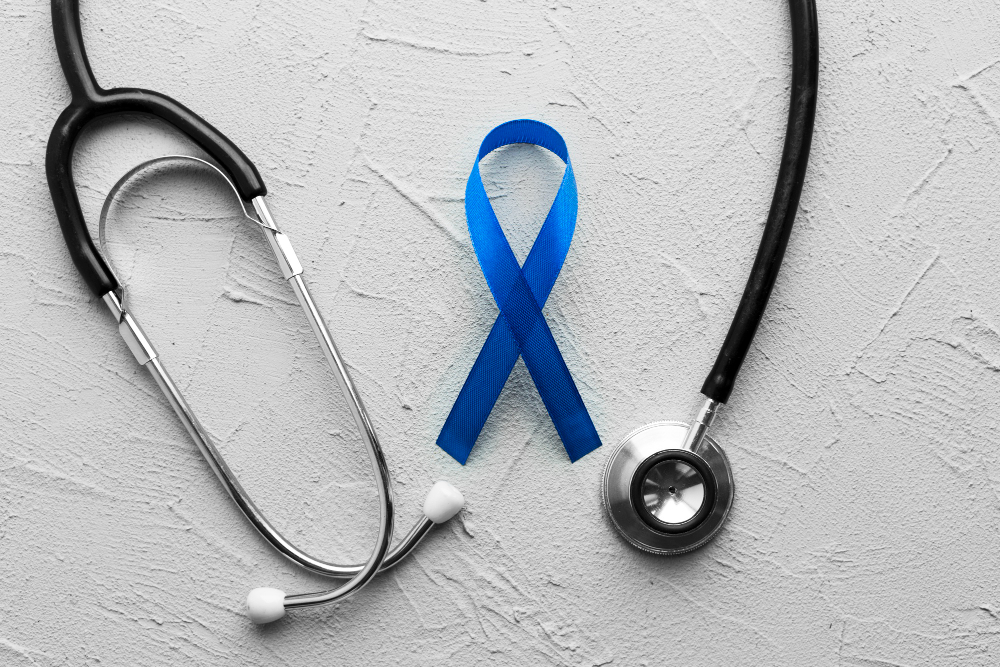 stethoscope around colon cancer ribbon