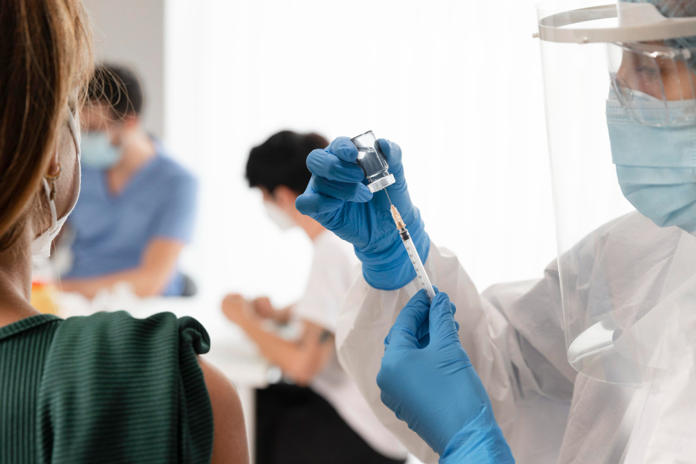 vaccination center with doctor holding syringe