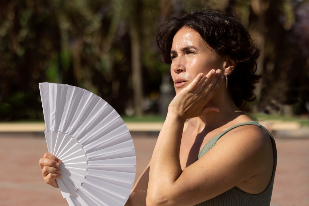 elder woman struggling with high temperature
