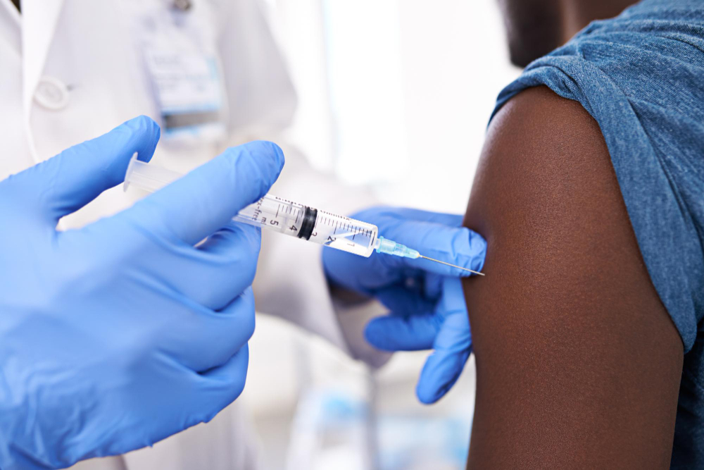 get one before flu season closeup shot male patient receiving injection from doctor