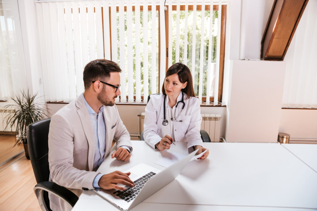 Female doctor discussing with manager