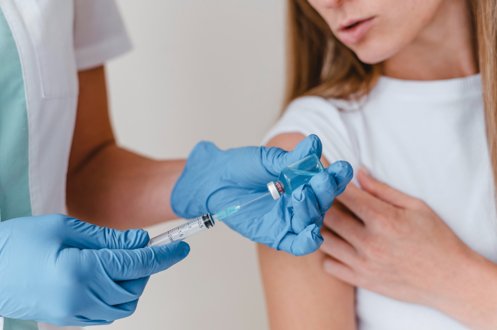 doctor with gloves preparing vaccine woman