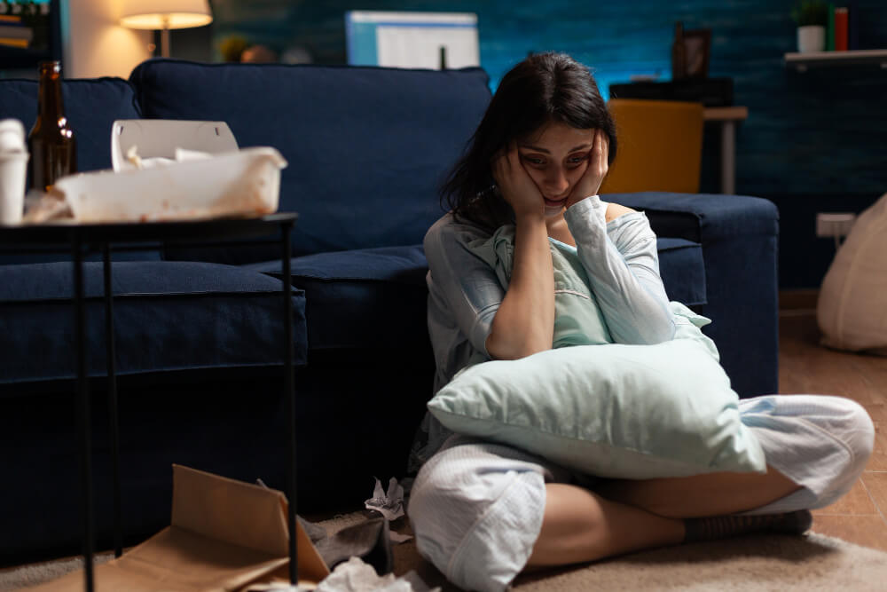 lonely traumatised frustrated ill woman holding head hands feeling vulnerable ()