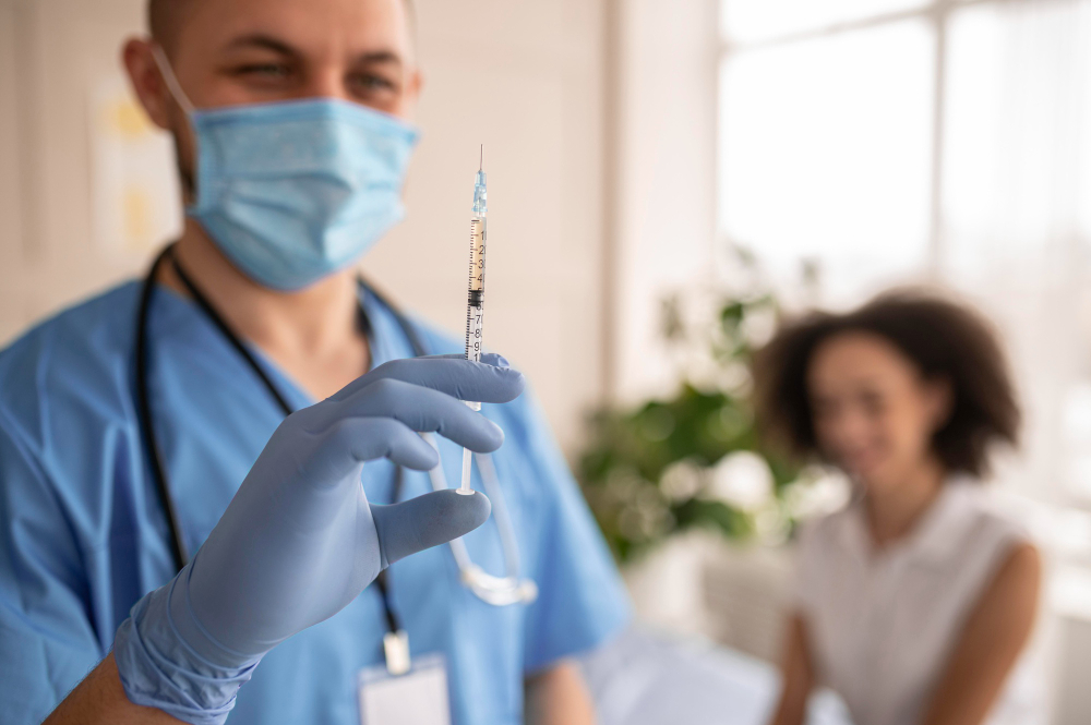 doctor holding syringe with vaccine patient