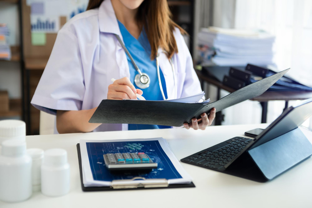 medical technology concept doctor working with mobile phone used calculator digital tablet laptop modern office hospital